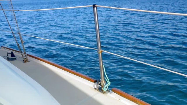 4K Yacht Boat Bow and Deck Railing, Blue Ocean Water Moving in Background