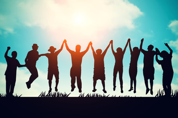 silhouette of Group  Hipster Teenagers Jumping at the sunset