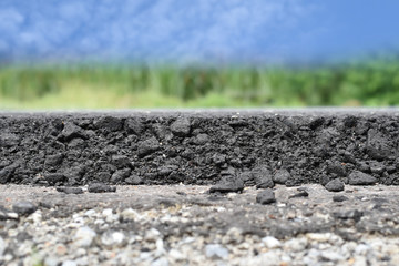 layer of asphalt raw material in a shallow dept of field