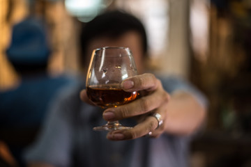 drunk man with a glass of brandy.