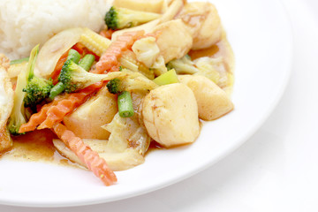 Stir Fried Tofu in Chinese Style,Deep Fried Tofu with Gravy Sauce ,Stir fried tofu with mixed vegetables in white plate on white background. Vegetarian Food, healthy food.