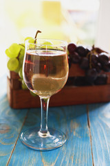 Wine glass on the table and grapes
