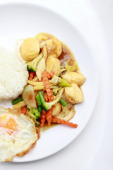 Stir Fried Tofu in Chinese Style,Deep Fried Tofu with Gravy Sauce ,Stir fried tofu with mixed vegetables in white plate on white background. Vegetarian Food, healthy food.