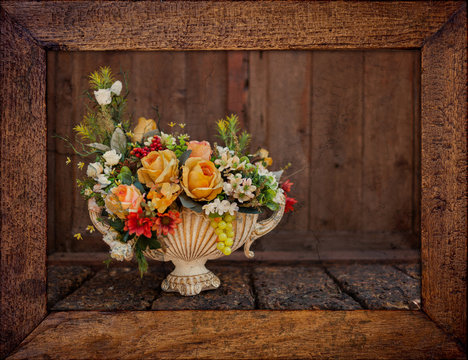 Vintage style flower vase in wooden picture frame
