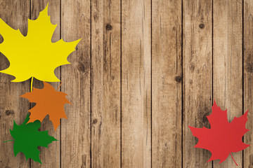 thanksgiving day concept with colourful maples on wooden background