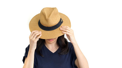 Casual South East Asian girl wearing hat hiding face