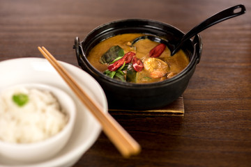 Steamed rice and prawn curry is ready.