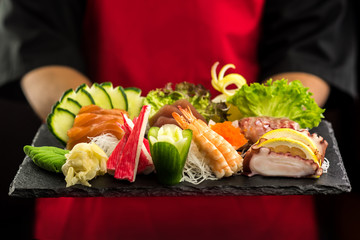 Sea foods is ready on black stone. © stockyimages