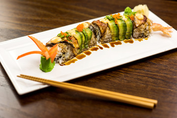 Sushi shrimp on a white plate.