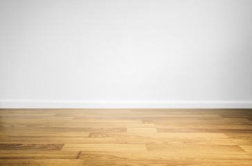 Laminated wood floor with white wall