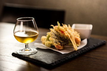 Tasty vegetable tempura with wine