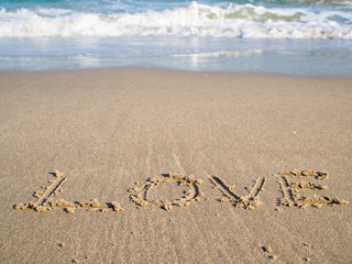 Valentine's Day The word love written on the sand