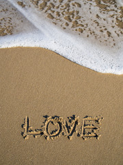 Valentine's Day The word love written on the sand