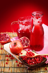 Pomegranate juice with red background