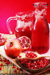 Pomegranate juice with red background