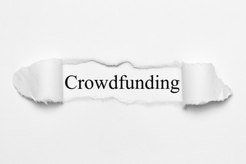 Crowdfunding on white torn paper