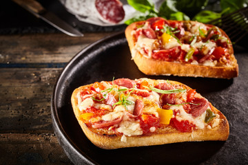Two slices of tasty pizza bread on pan