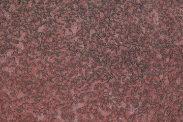 closeup of a red carpet with rubber