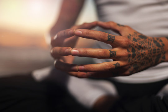 Closeup of male hands in meditation position