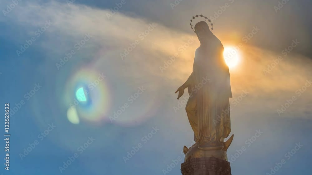 Wall mural holy mary monument with sun behind it on square in front of the cathedral timelapse in zagreb, croat