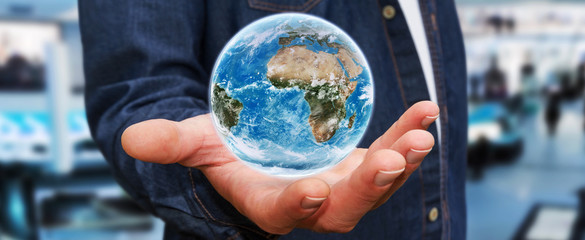 Man holding the planet earth in his hand