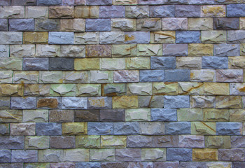 a wall of multi-colored marble tiles
