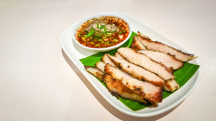 Grilled sliced Pork BBQ Savory and spicy sauce . Adjust the image darker tone