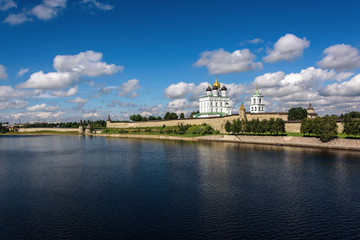 Fototapeta na wymiar View of the Pskov Kremlin from Velikaya River in the summer in a sunny weather