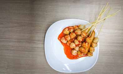 Roasted pork balls or meatballs with sweet spicy sauce