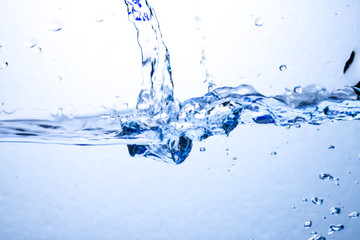 Fototapeta na wymiar Closeup water wave and air bubbles in water.