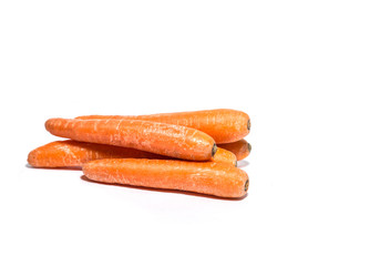 Prepared to cook fresh raw carrots isolated on white