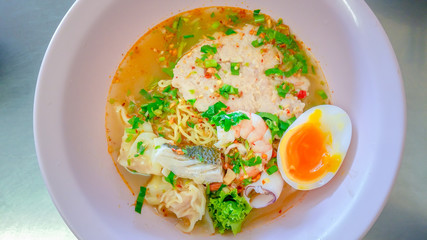 Tom Yum pork wonton hot and sour soup. pork dumpling And seafood.