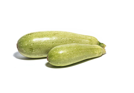 Big and small zucchini isolated on white