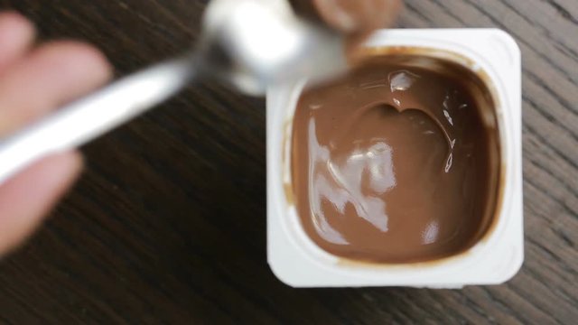 chocolate mousse eat with a spoon. close-up. top view