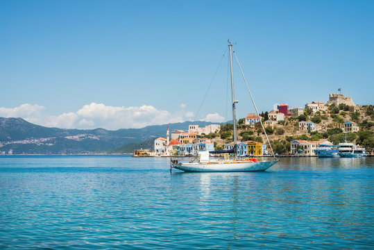 Fototapeta Yacht in bay of Kastelorizo island on sunny summer day, Dodecanese, Greece