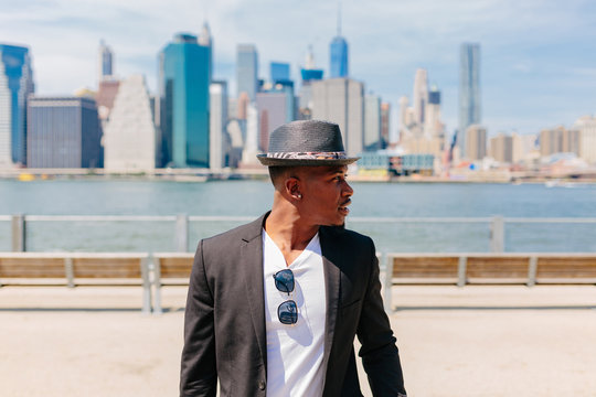 Young Fashionable Businessman Heading To Work . Manhattan Background New York City