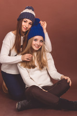 Two friends girls in winter clothes