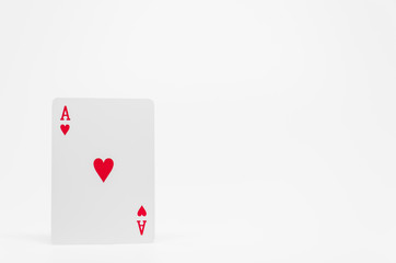 Red heart Ace card on white background and selective focus