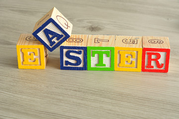 Easter spelled with colorful alphabet blocks isolated against a