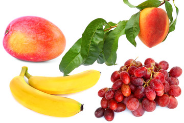 Exotic fruits isolated on a white background. Mango, peach, banana, grapes