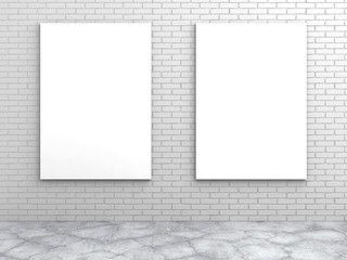 two white blank frames on a brick wall