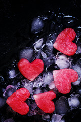 Sweet hearts of watermelon on crushed ice, top view