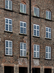 Brown Brick and Wooden Framed Windows