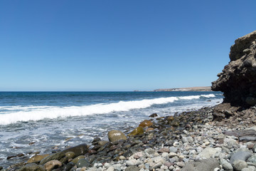 Fototapeta na wymiar Awesome Wave Crest at Meloneras Beach / Spain