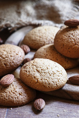 Homemade cookies with nuts, dark wood background, selective focu