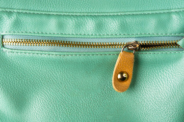 seams on leather hand bag