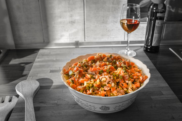 Simple dinner prepared in domestic kitchen,  Boeuf Salad and red