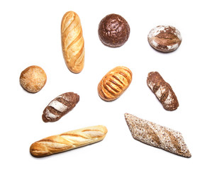Different kinds of bread on white top view