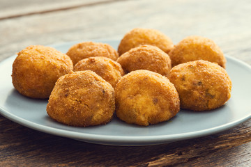 Arancini sicilian street food - rice balls stuffed with meat cooked