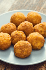 Arancini sicilian street food - rice balls stuffed with meat cooked